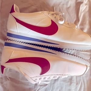 Nike Cortez shoes, white with a red Nike swoosh